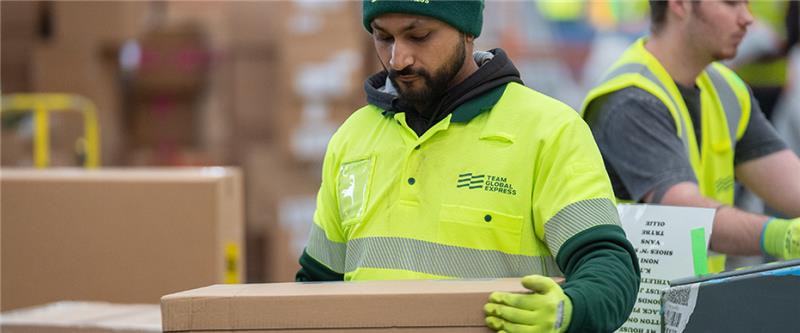 Team Global Express worker with safety equipment