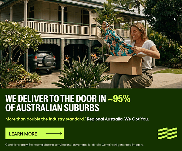 Woman sitting in regional Australia opening a delivered parcel